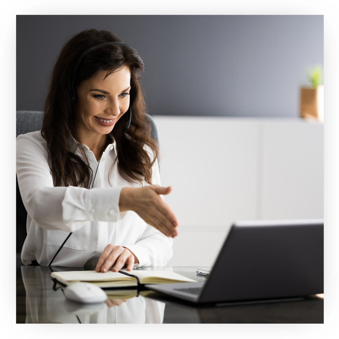 Woman talking to her laptop screen